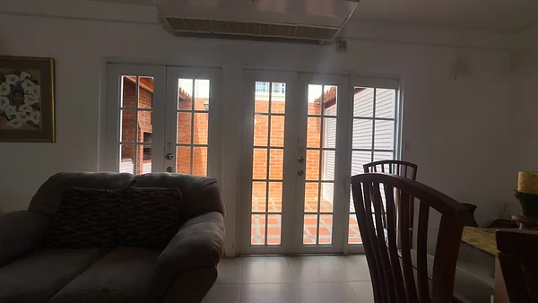 Guest bedroom with large windows