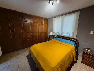 Cozy bedroom with large bed