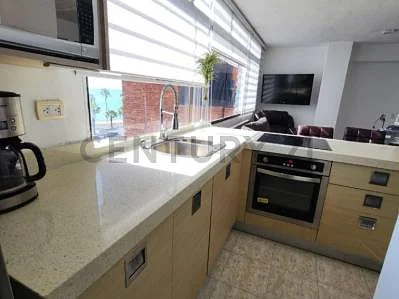 Compact kitchen with white cabinets