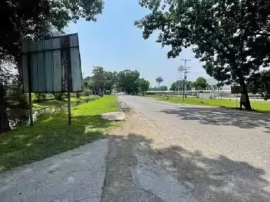 Dirt road leading into property
