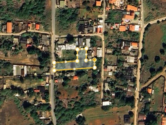 Wide aerial view of property land